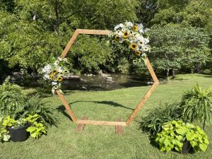 Riverside Ceremony setup with arbor